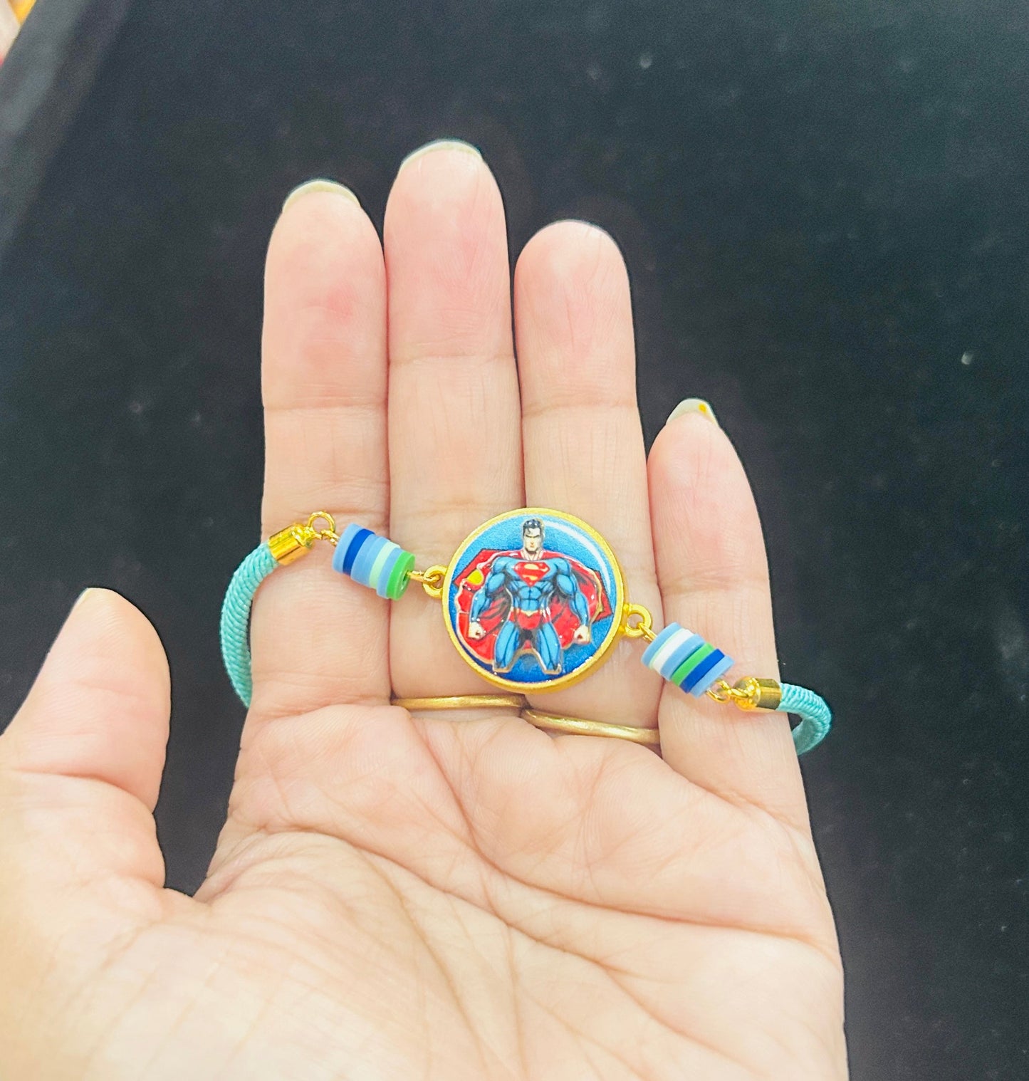 Superman Bracelet Spinner Rakhi with Chocolate [Aqua Green]