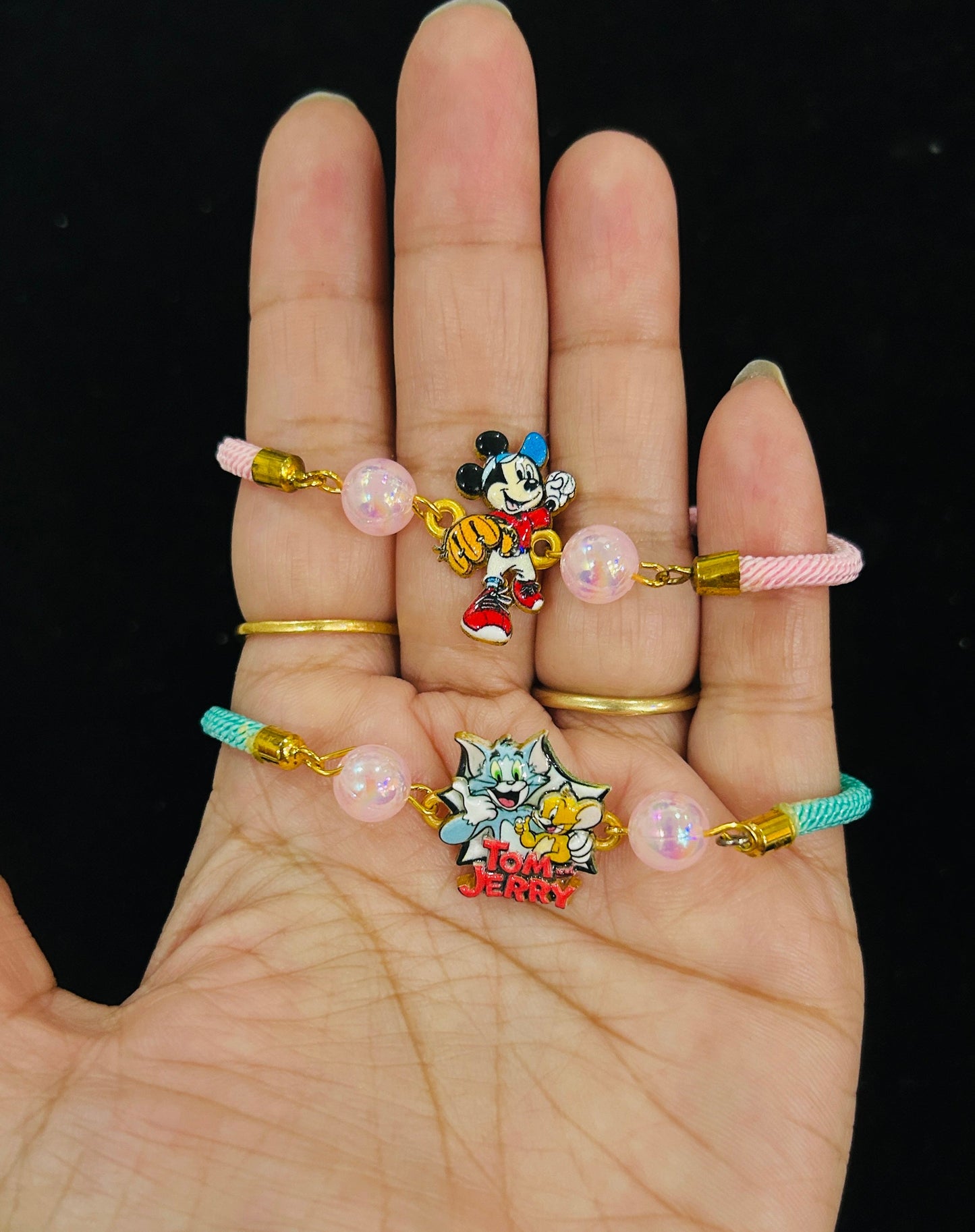 A Tom-Jerry Rakhi and Mickey Rakhi [Set of 2] with 2 Chocolates
