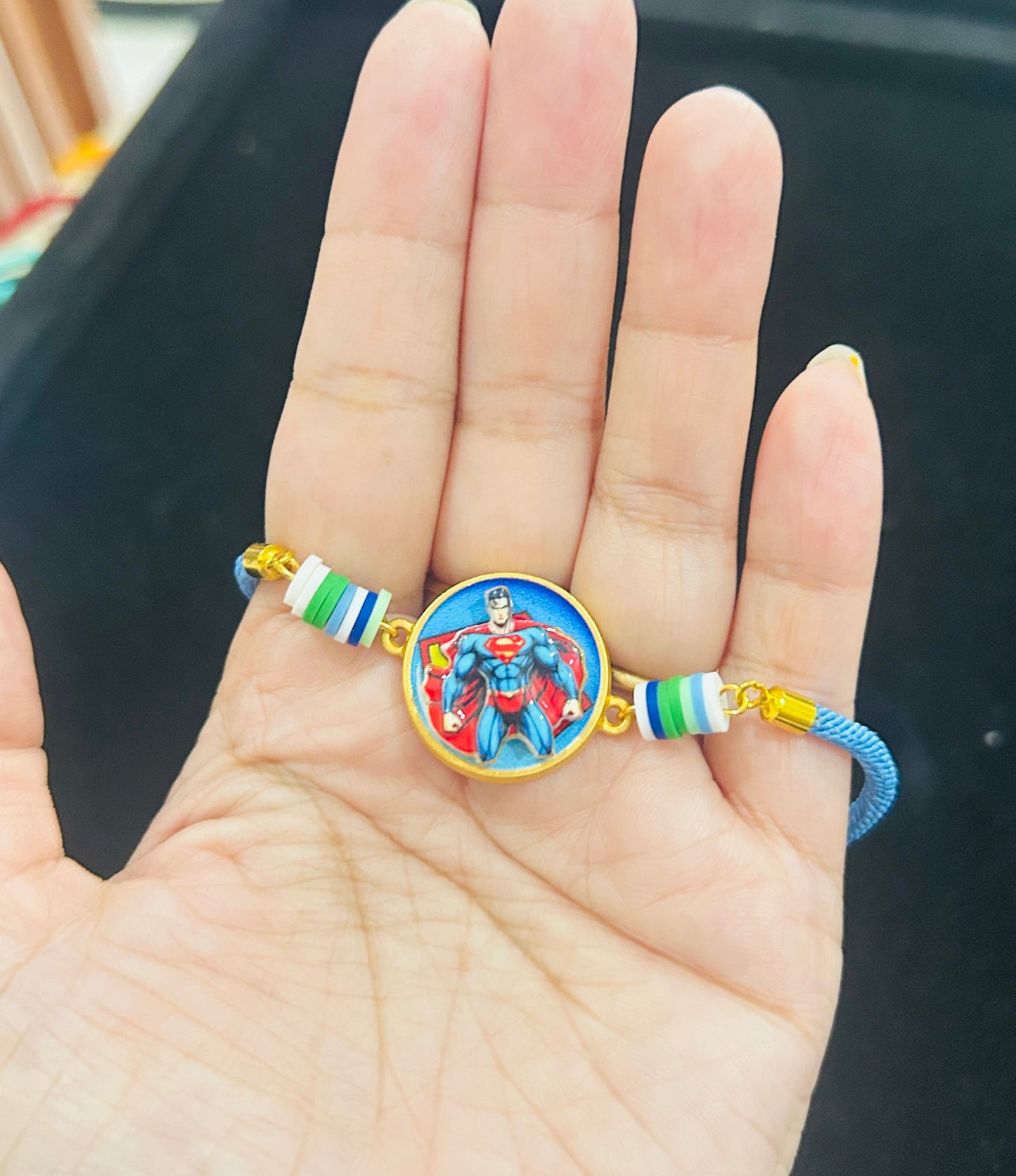 Superman Bracelet Spinner Rakhi with Chocolate [Light Blue]