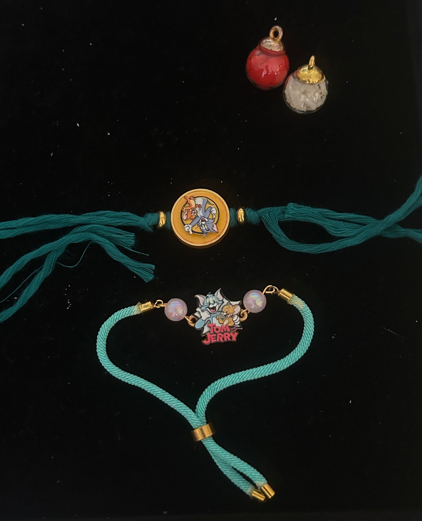 Tom and Jerry Set of Spinner And Charm Rakhi [Set of 2]